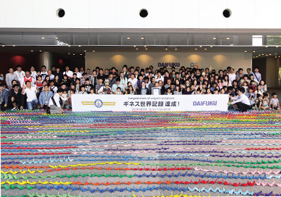 Sets a new Guinness World Record—longest chain of origami sculptures—